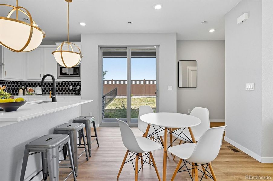 Kitchen/dining with sliding doors to patio and fenced side yard