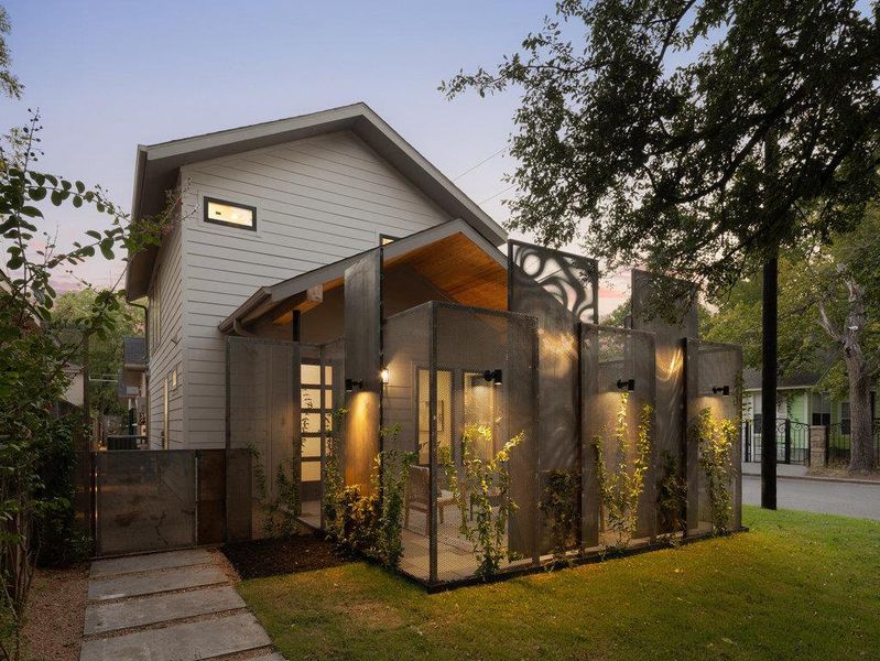 View of front of house featuring a gate