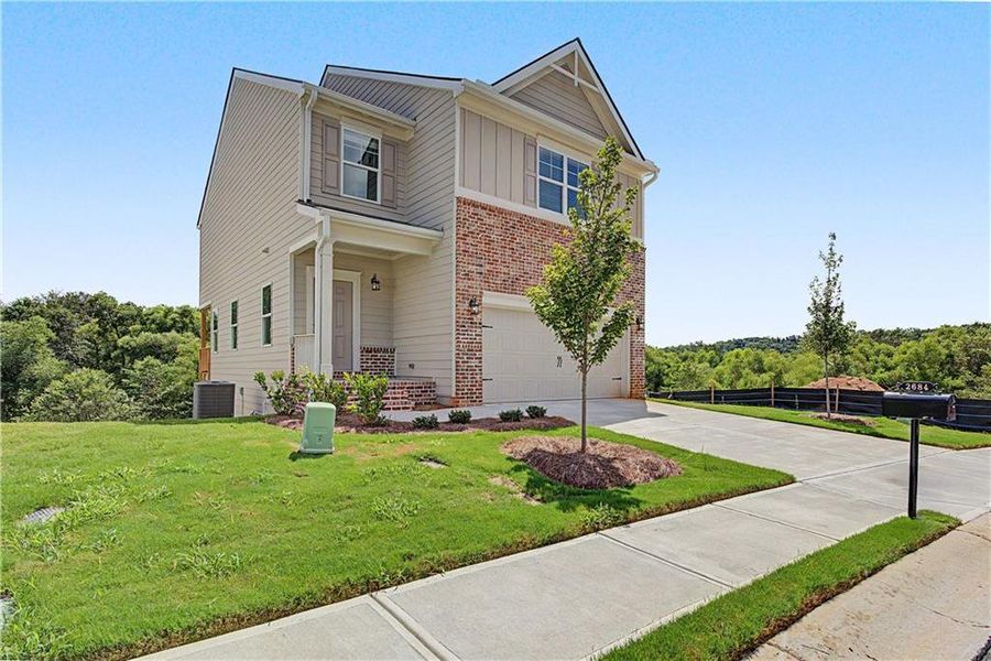 Front exterior of a new home in The View at Groover's Lake, Lithia Springs, GA, highlighting curb appeal (Image 25).