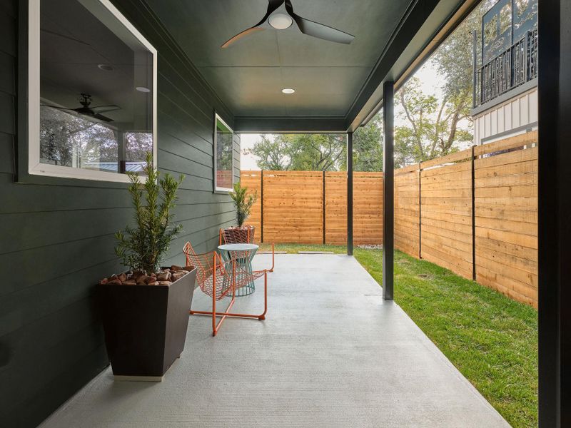 Fenced backyard with ceiling fan and a patio Fenced backyard with ceiling fan and a patio