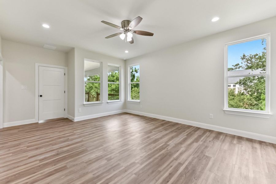 Primary Bedroom with view of back porch and greenbelt area Primary Bedroom with view of back porch and greenbelt area