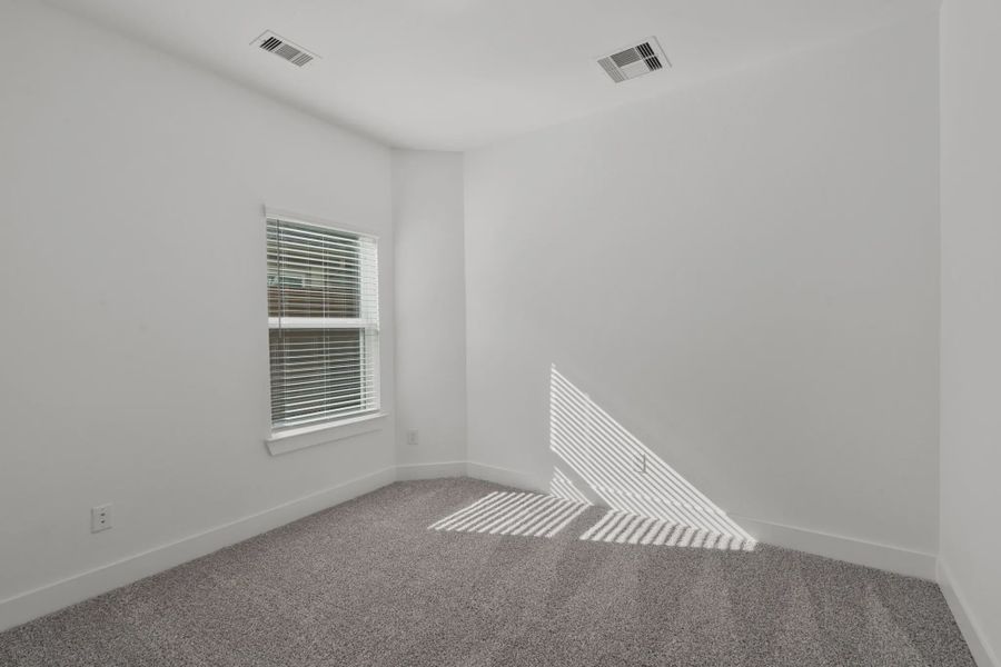 Representative unfurnished interior of a home built from the Carriagehouse by Chesmar Homes in Meridiana Townhomes, Iowa Colony (Image 92).