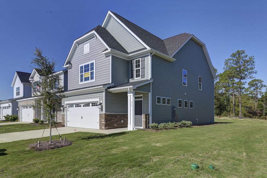 Front exterior of a new home in Ashton Lakes, Lexington, SC, highlighting curb appeal (Image 27).