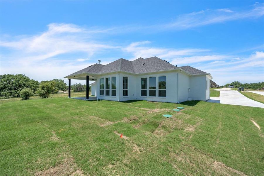Front exterior of a new home in , Springtown, TX, highlighting curb appeal (Image 11).
