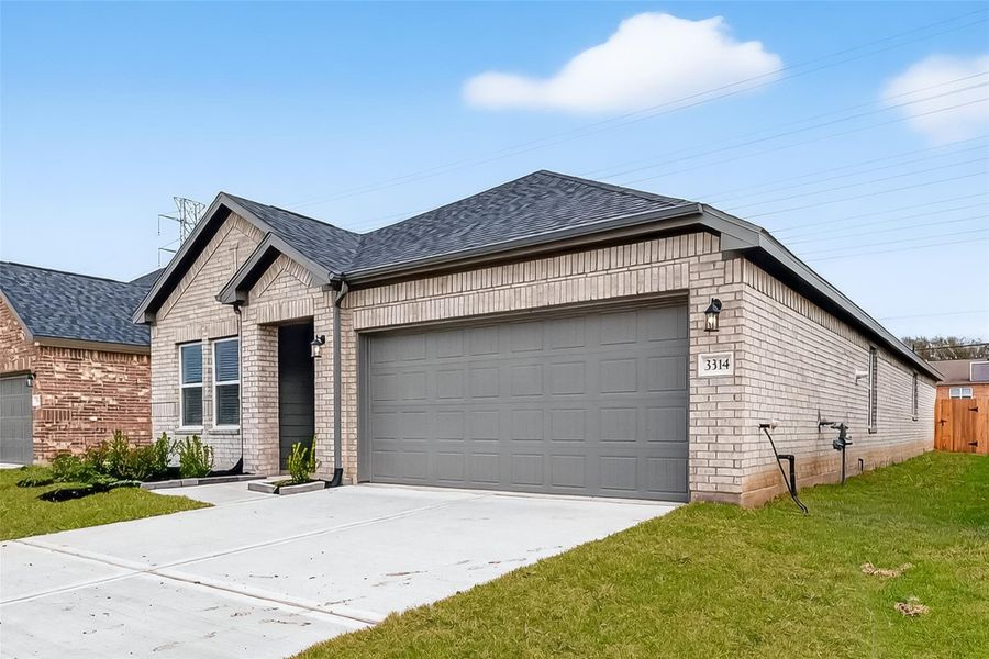 Front exterior of a new home in Rollingbrook Estates, Baytown, TX, highlighting curb appeal (Image 24).