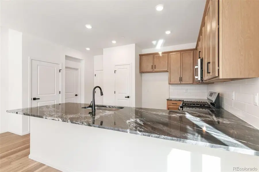 Furnished interior view inside a new home in Turnberry Villas, Commerce City (Image 15).