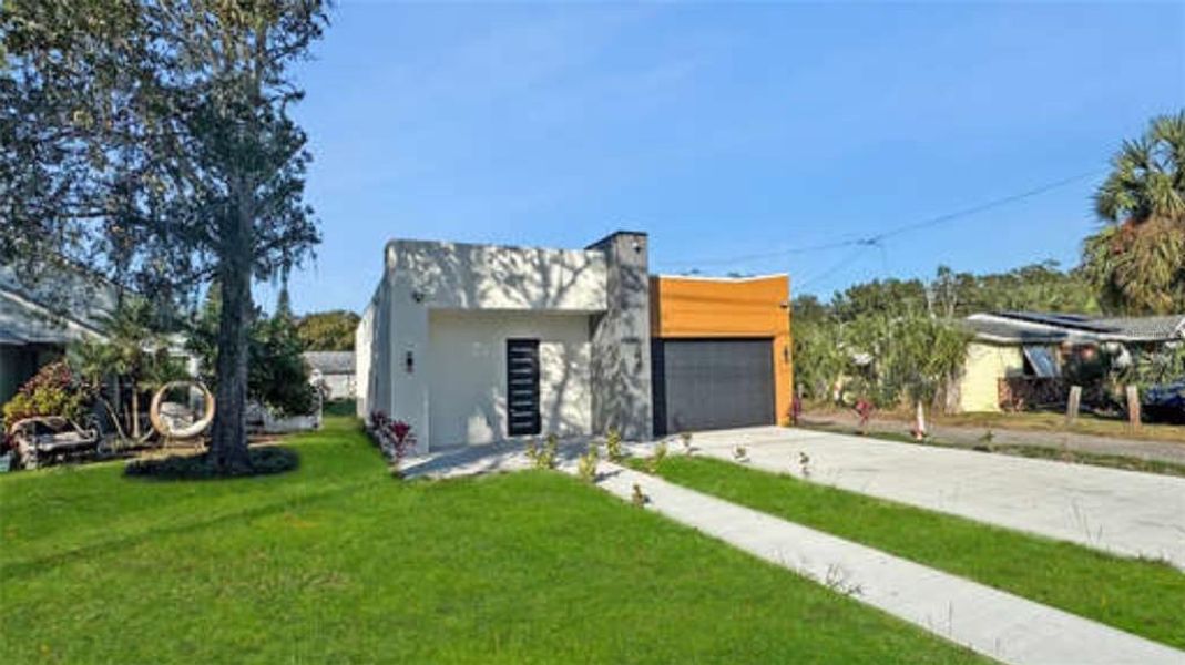 Front exterior of a new home in , Apopka, FL, highlighting curb appeal (Image 17). Front exterior of a new home in , Apopka, FL, highlighting curb appeal (Image 17).