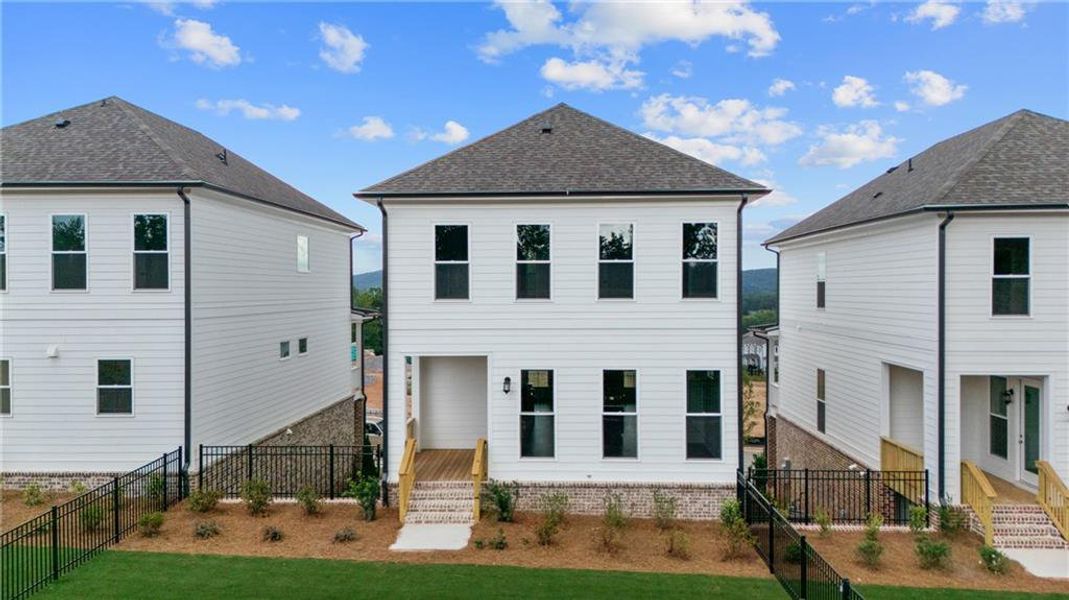 Front exterior of a new home in Palisades Single Family, Cumming, GA, highlighting curb appeal (Image 25).