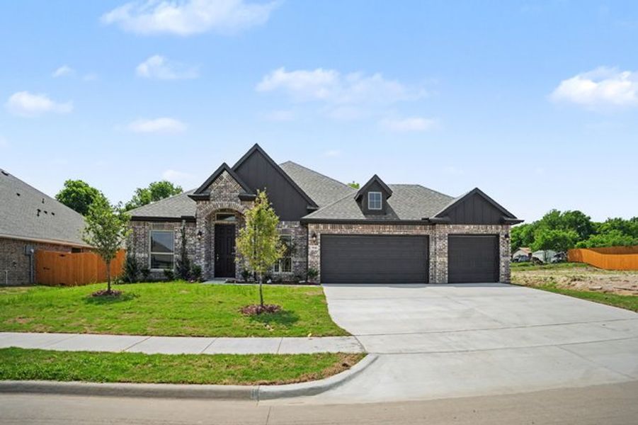 Front exterior of a new home in Cole Crossing Estates, DeSoto, TX, highlighting curb appeal (Image 2). Front exterior of a new home in Cole Crossing Estates, DeSoto, TX, highlighting curb appeal (Image 2).