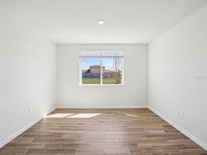 Spacious, unfurnished interior of a new home in Colbert Landings - Reserve Series, Palm Coast (Image 7).