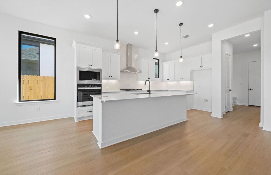 Furnished interior view inside a new home in 6 Creeks, Kyle (Image 9).