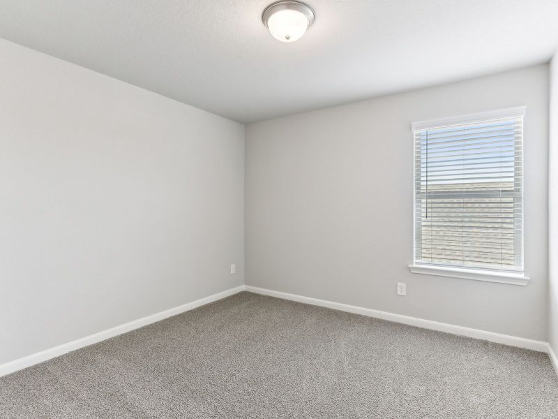 Guest bedroom in the Matador floorplan at a Meritage Homes community.