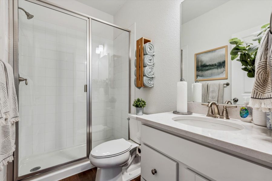 A bathroom with a glass shower. A bathroom with a glass shower.