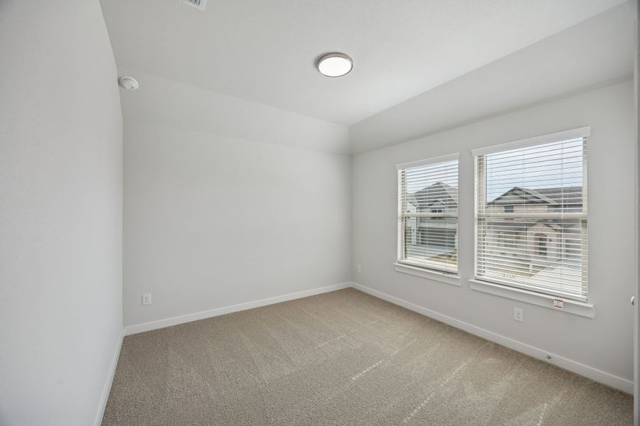 Bedroom in the Masters home plan by Trophy Signature Homes – REPRESENTATIVE PHOTO