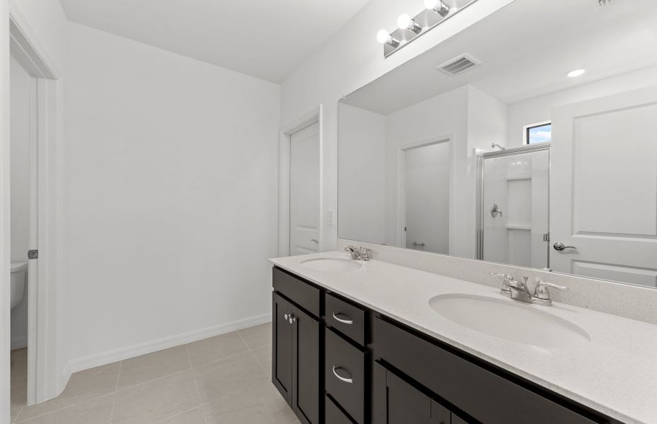 Furnished interior view inside a new home in Whispering Lakes, Lehigh Acres (Image 10).