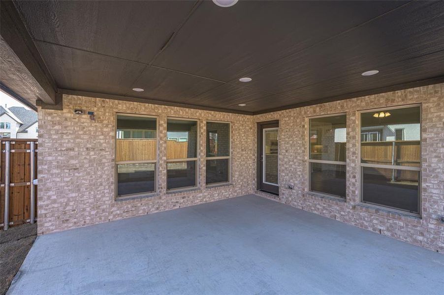Exterior details and patio area of a home in Creekview Meadows, Pilot Point (Image 4).