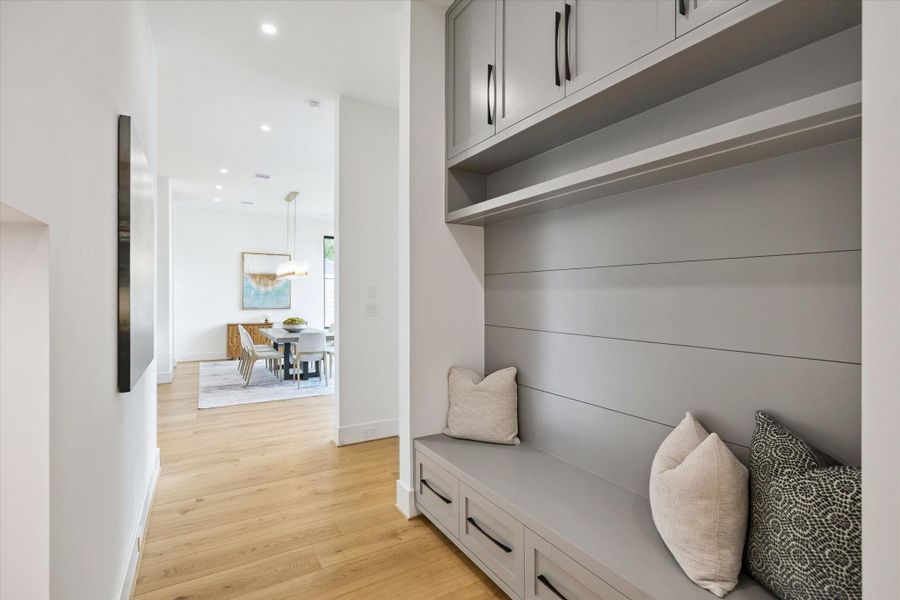 Mudroom with built-in bench, storage drawers, and shiplap details. Mudroom with built-in bench, storage drawers, and shiplap details.
