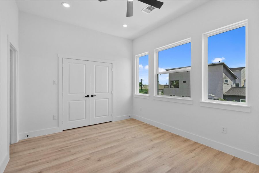 Airy bedroom retreat featuring soaring ceilings, oversized windows and a bright modern aesthetic Airy bedroom retreat featuring soaring ceilings, oversized windows and a bright modern aesthetic