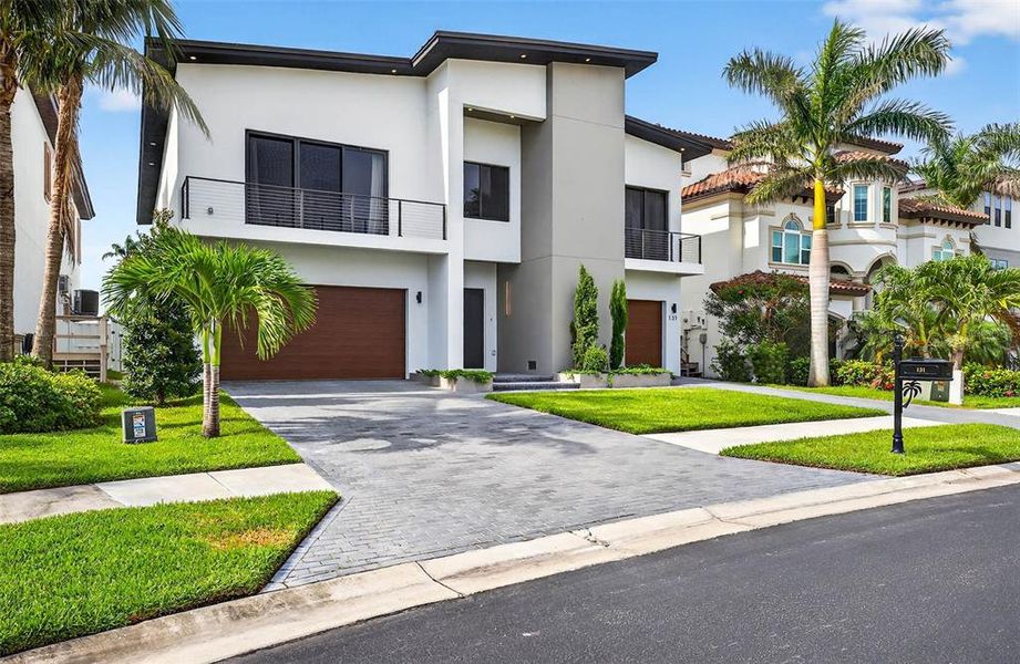 Front exterior of a new home in , Redington Shores, FL, highlighting curb appeal (Image 25).