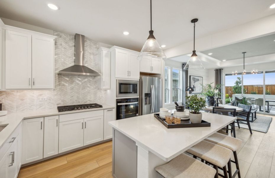 Spacious kitchen with pendant lighting