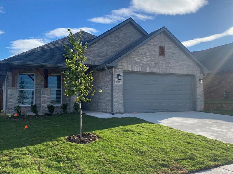 Exterior details and patio area of a home in The Preserve At Country Ridge, Sherman (Image 18).