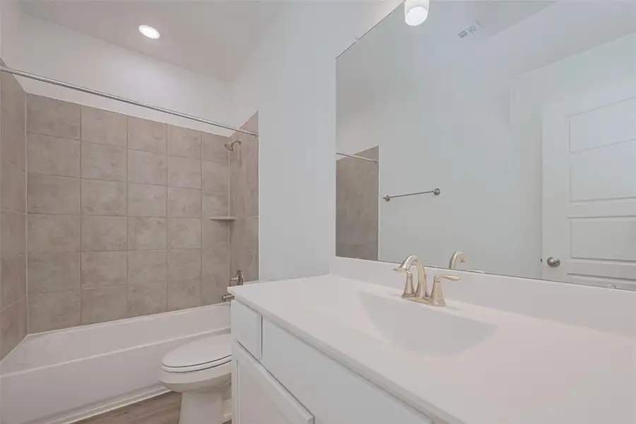 Furnished interior view inside a new home in Sunterra, Katy (Image 10).