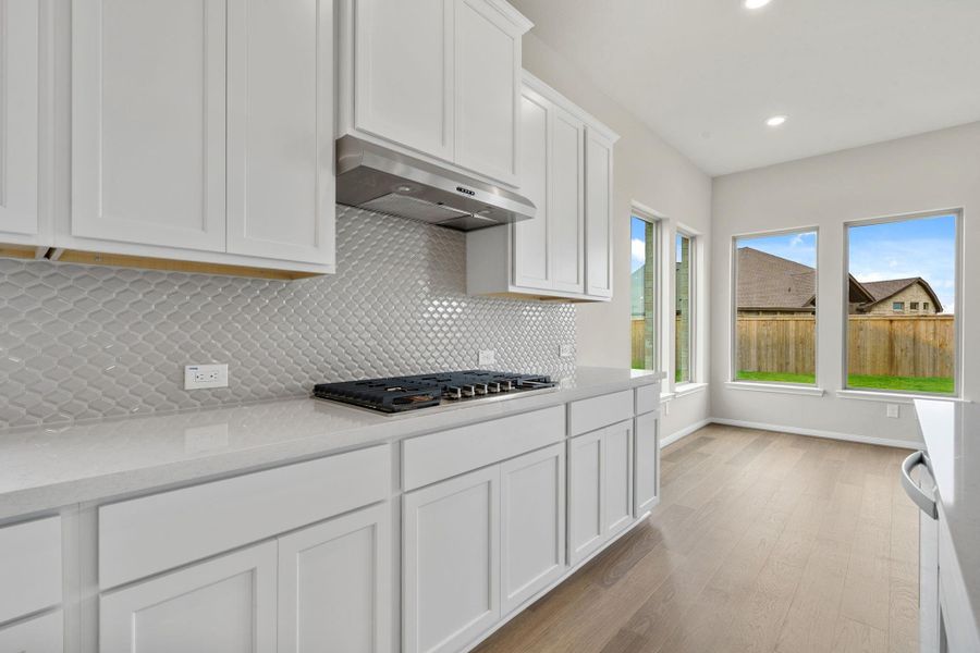 Furnished interior view inside a new home in Bridgeland, Cypress (Image 9).