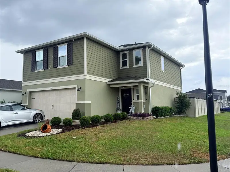 Front exterior of a new home in , Auburndale, FL, highlighting curb appeal (Image 1). Front exterior of a new home in , Auburndale, FL, highlighting curb appeal (Image 1).