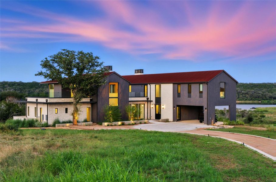 Modern home with driveway and a garage