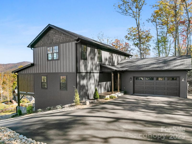 Front exterior of a new home in , Fairview, NC, highlighting curb appeal (Image 1).