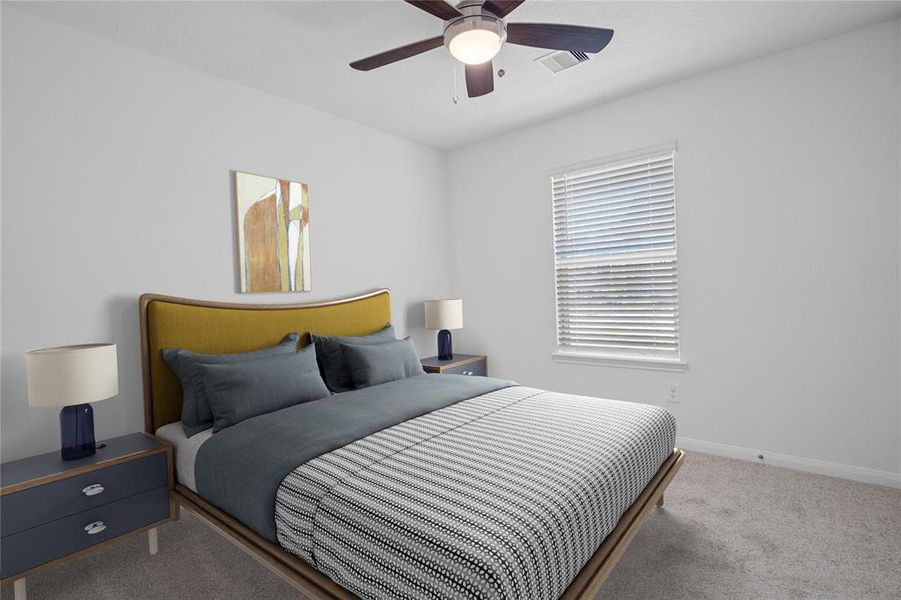 Secondary bedroom features plush carpet, high ceiling with ceiling fan, and a large window with privacy blinds.