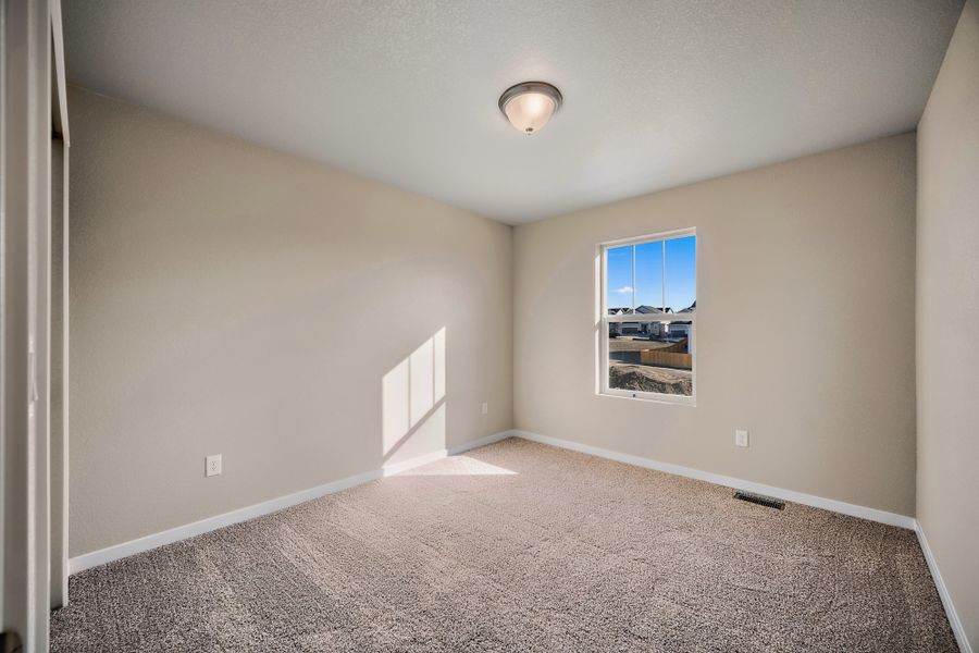 Spacious, unfurnished interior of a new home in Ridge at Lorson Ranch, Colorado Springs (Image 30).