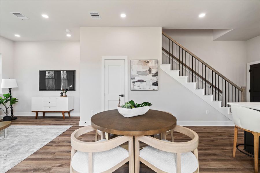 A beautifully designed kitchen anchors the home with a spacious island, ample cabinetry, and a bright, modern feel. The open layout makes it easy to cook, host, and stay connected to the rest of the home.