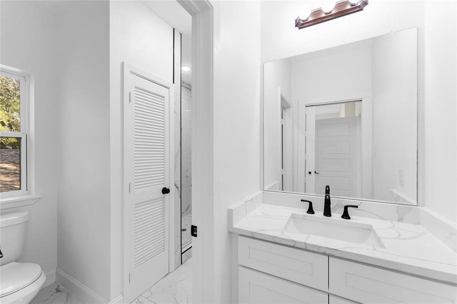 Bathroom with vanity and toilet