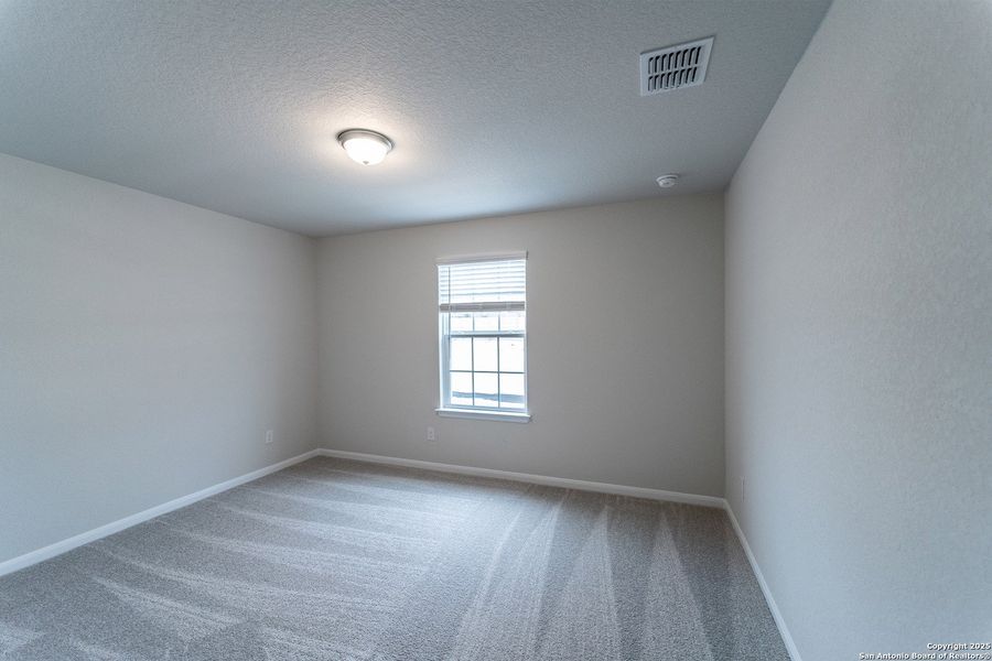 Spacious, unfurnished interior of a new home in The Woodlands at Medina Hills, Mico (Image 14).