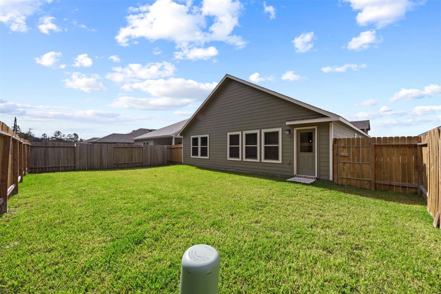 Exterior details and patio area of a home in Enclave at Dobbin, Magnolia (Image 3). Exterior details and patio area of a home in Enclave at Dobbin, Magnolia (Image 3).