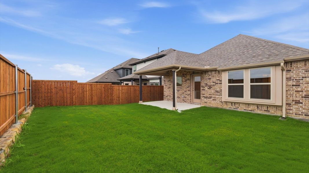 Exterior details and patio area of a home in Westridge Journey, Princeton (Image 26).