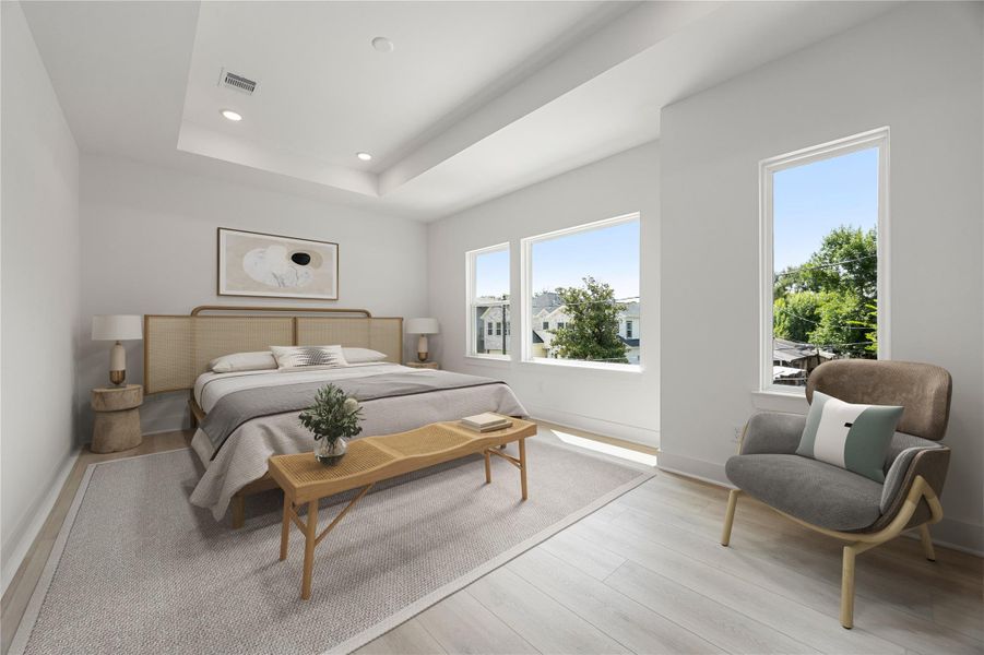 What a wonderful place to come home to! This stunning primary suite greets you with gorgeous wood like vinyl floors, neutral paint, high tray ceiling, lovely windows with blinds allowing in natural light brightening up this spacious primary bedroom with extra space for a seating area. What a wonderful place to come home to! This stunning primary suite greets you with gorgeous wood like vinyl floors, neutral paint, high tray ceiling, lovely windows with blinds allowing in natural light brightening up this spacious primary bedroom with extra space for a seating area.