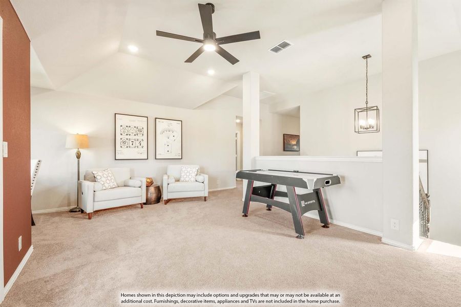 Bonus room with air hockey table, seating area, vaulted ceiling, and ceiling fan over carpet flooring Bonus room with air hockey table, seating area, vaulted ceiling, and ceiling fan over carpet flooring