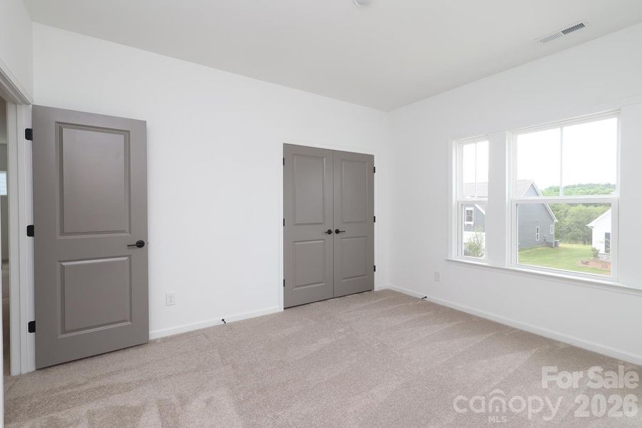 Spacious, unfurnished interior of a new home in Estates at Sugar Creek, Indian Land (Image 40).