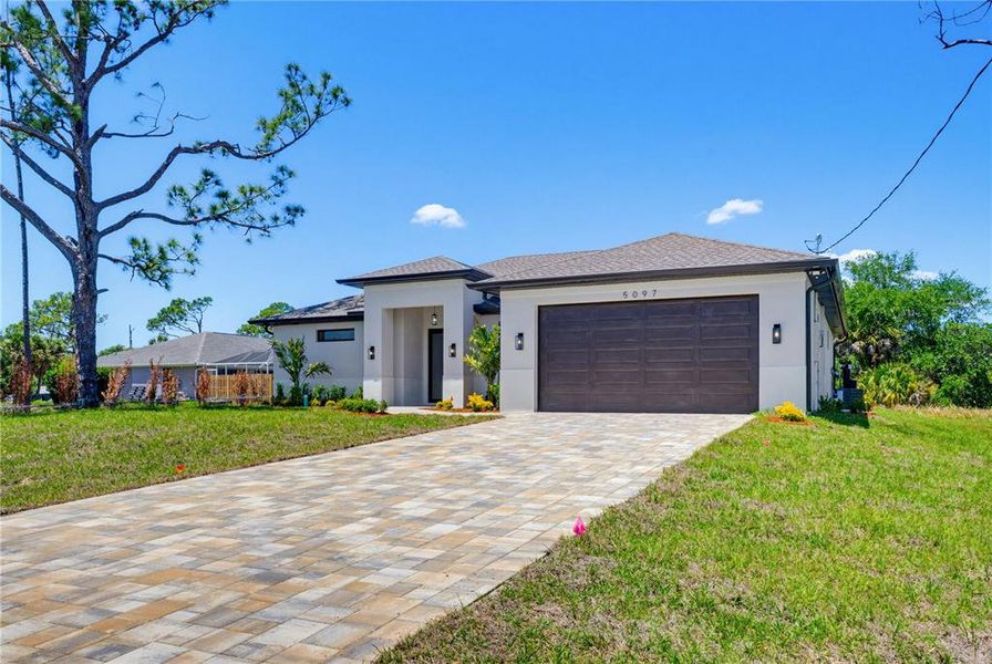 Front exterior of a new home in , North Port, FL, highlighting curb appeal (Image 25).