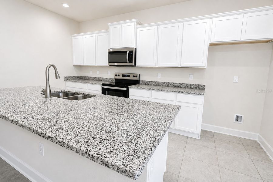 Furnished interior view inside a new home in Harmony Central, St. Cloud (Image 7).