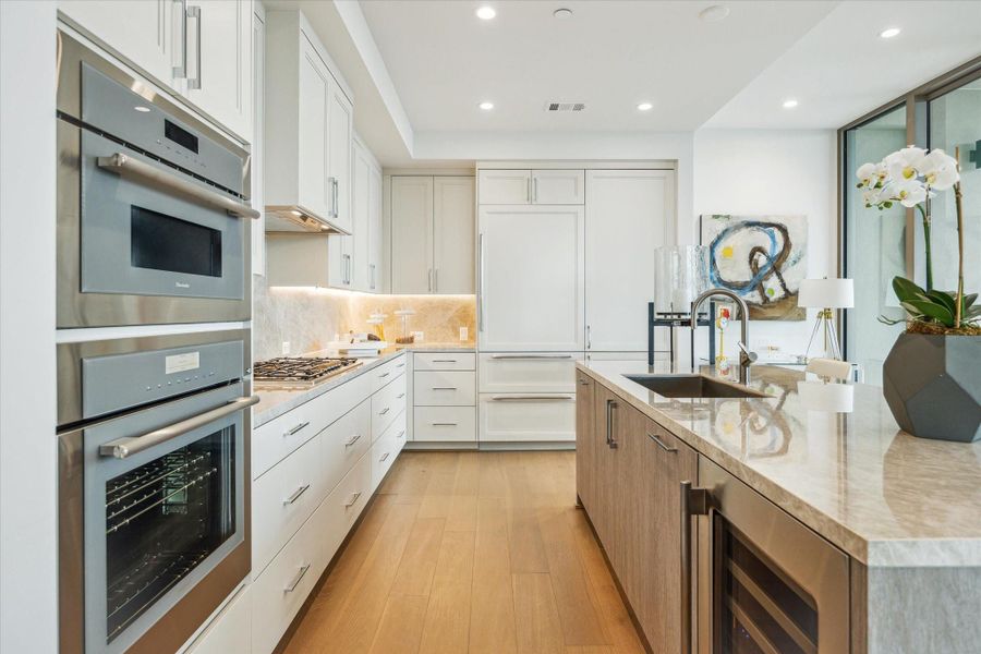 Spacious Kitchen featuring top-of line Thermador appliances, Wine Chiller and Sub-zero refrigerator with two freezer drawers. Photos are of a similar unit with the same floor plan Spacious Kitchen featuring top-of line Thermador appliances, Wine Chiller and Sub-zero refrigerator with two freezer drawers. Photos are of a similar unit with the same floor plan