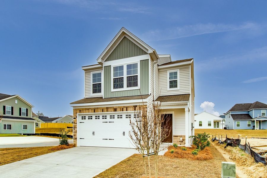Front exterior of a new home in Winston Point, Gilbert, SC, highlighting curb appeal (Image 20).