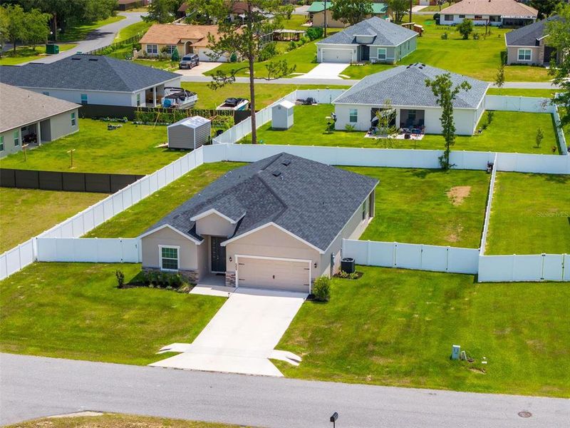Front exterior of a new home in Silver Springs Shores, Ocala, FL, highlighting curb appeal (Image 27). Front exterior of a new home in Silver Springs Shores, Ocala, FL, highlighting curb appeal (Image 27).