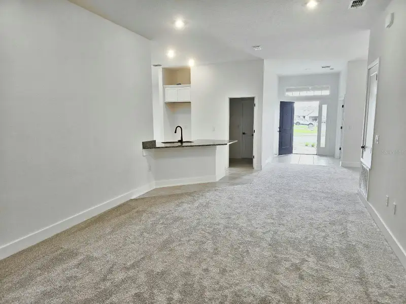 Spacious, unfurnished interior of a new home in Harmony Central, St. Cloud (Image 9).