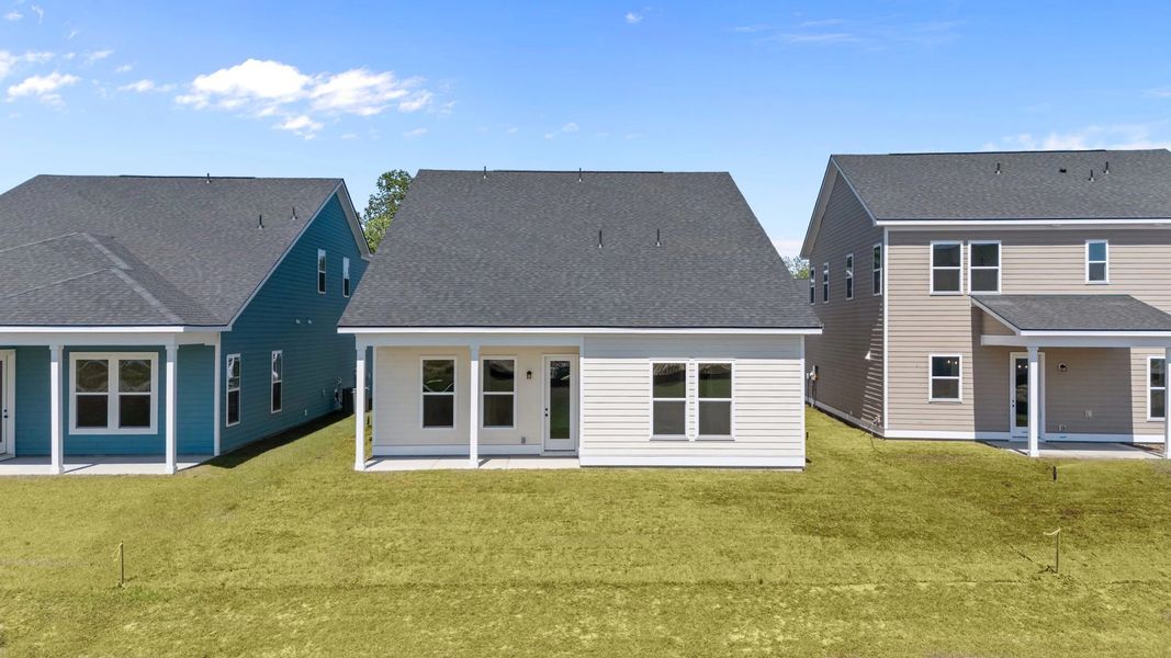 Exterior details and patio area of a home in Blue Heron Retreat, Little River (Image 4).