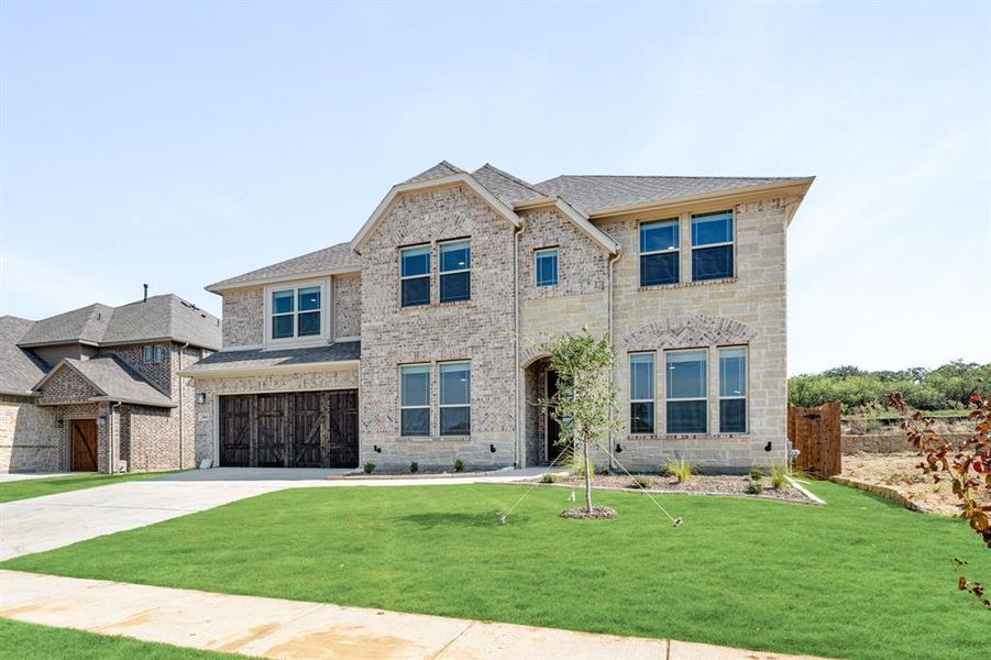 Front exterior of a new home in Parks at Panchasarp Farms 65, Burleson, TX, highlighting curb appeal (Image 26). Front exterior of a new home in Parks at Panchasarp Farms 65, Burleson, TX, highlighting curb appeal (Image 26).