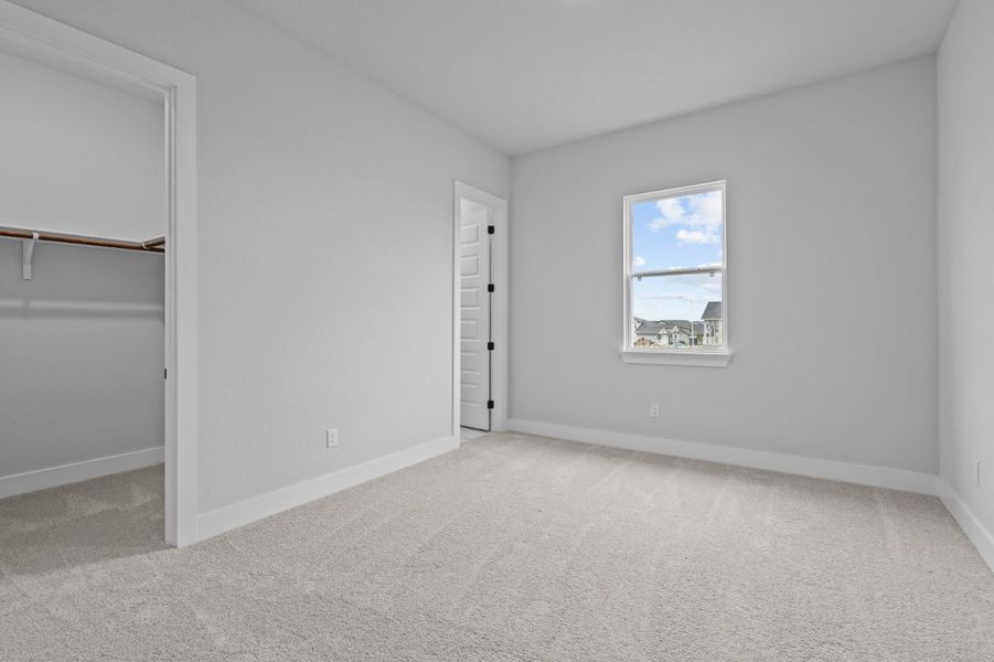 A room with a window and a door. A room with a window and a door.