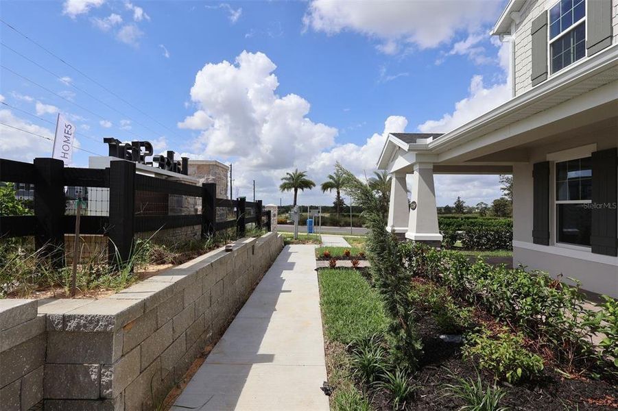 Exterior details and patio area of a home in Lake Star at Ovation, Winter Garden (Image 3).